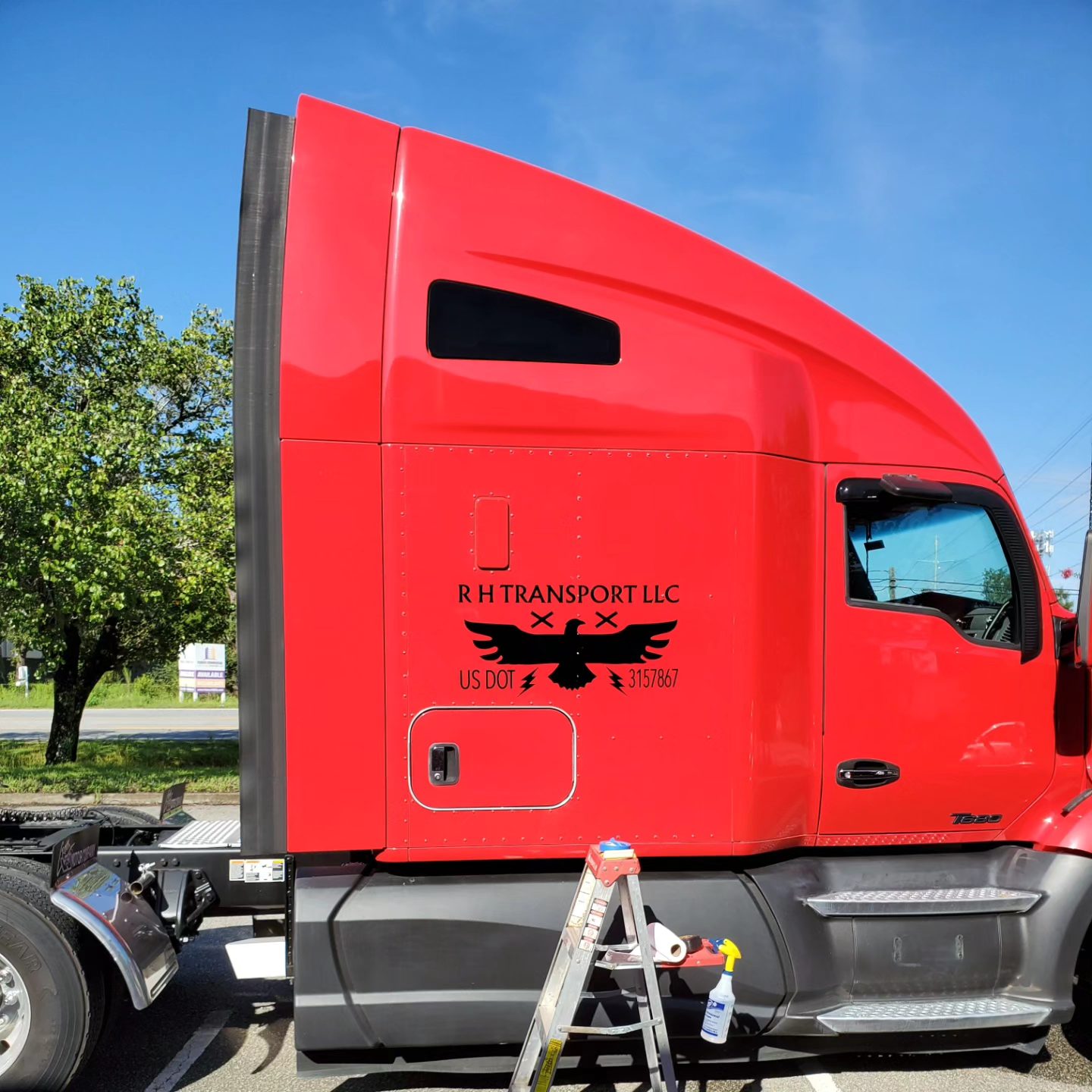 R H Transport big rig cab with red exterior and phoenix graphics